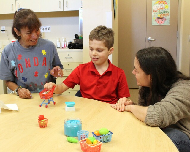 Student working with teachers